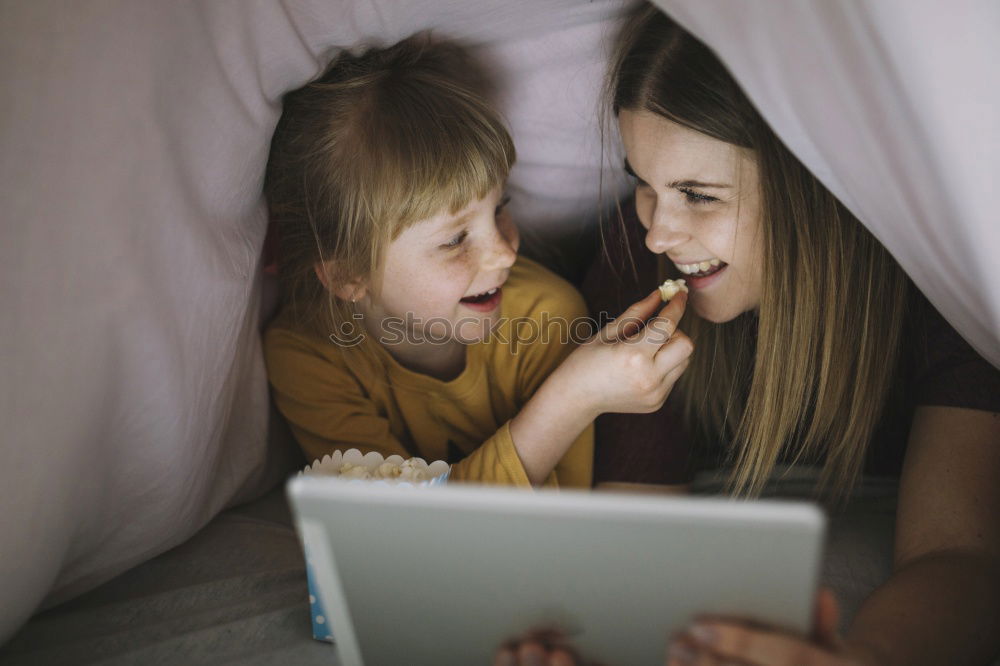 Similar – Mother and her child with digital tablet.