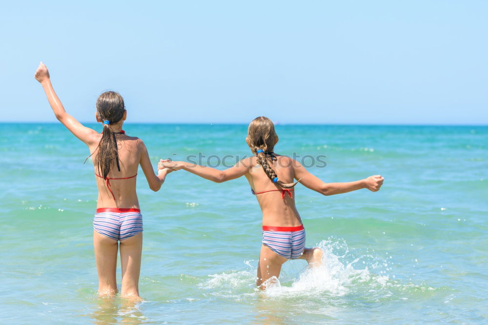 Similar – Two happy children playing on the beach