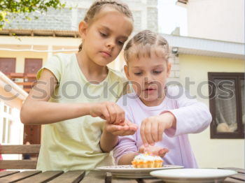 Similar – Image, Stock Photo Little sisters girl preparing baking cookies.