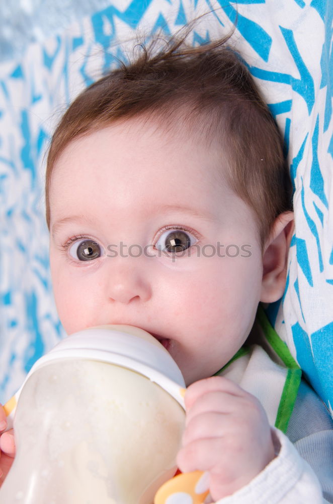 Similar – Image, Stock Photo A cute little girl in chef’s hat sitting on the kitchen floor soiled with flour, playing with food, making a mess and having fun