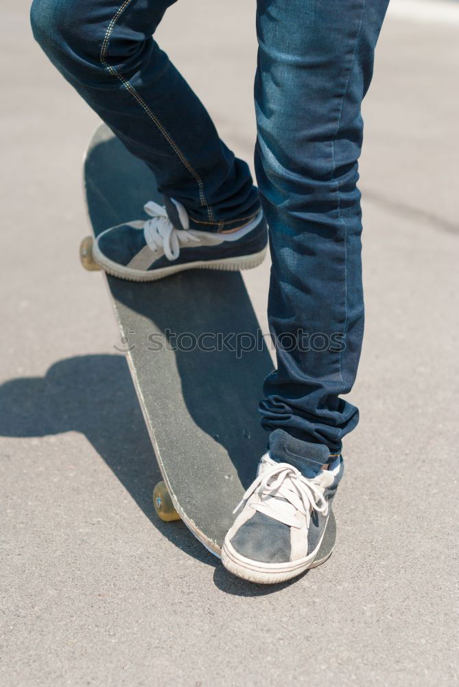 Similar – Man with tattoos holding skateboard at shore. Back view.