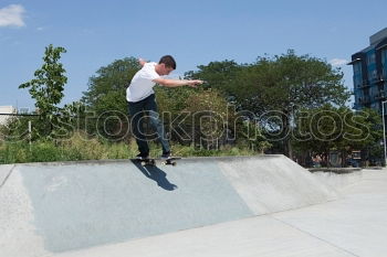 Similar – Girl on BMX bike in the air in halfpipe