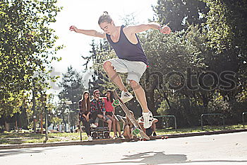 Similar – Image, Stock Photo Young sportsman performing his acrobatic skills in doing somersault. Show in the city street