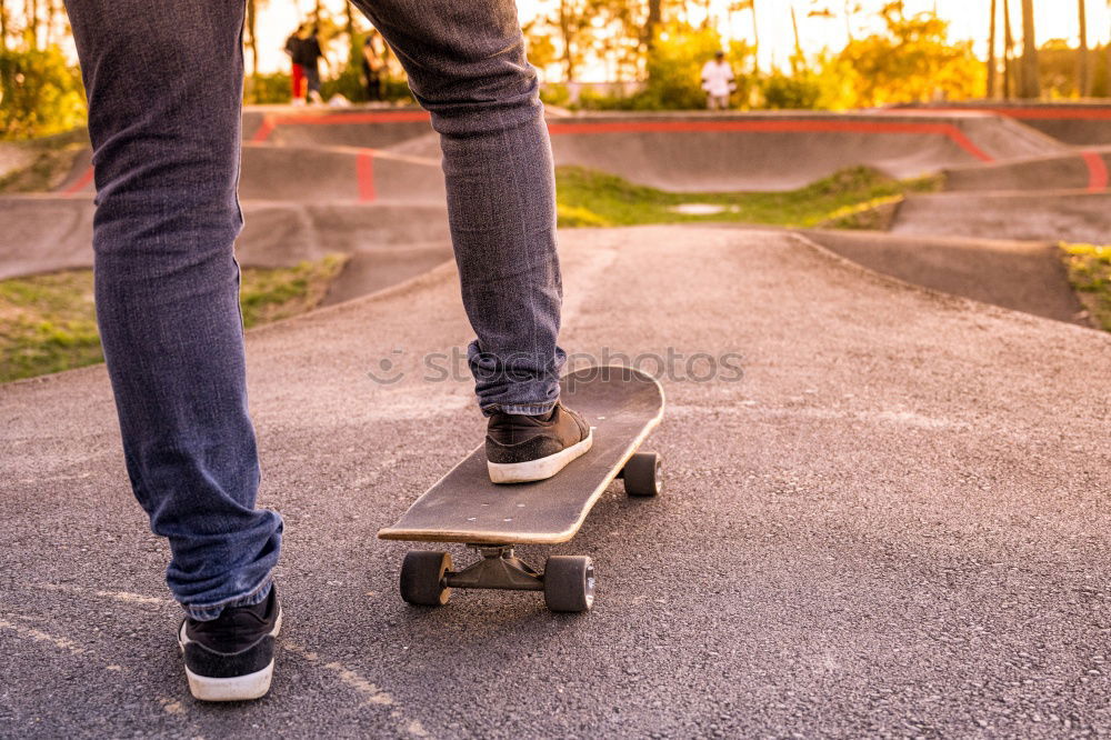 Similar – Person rides the skateboard