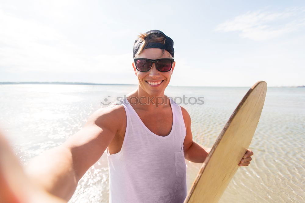 Similar – Man with skateboard at beach