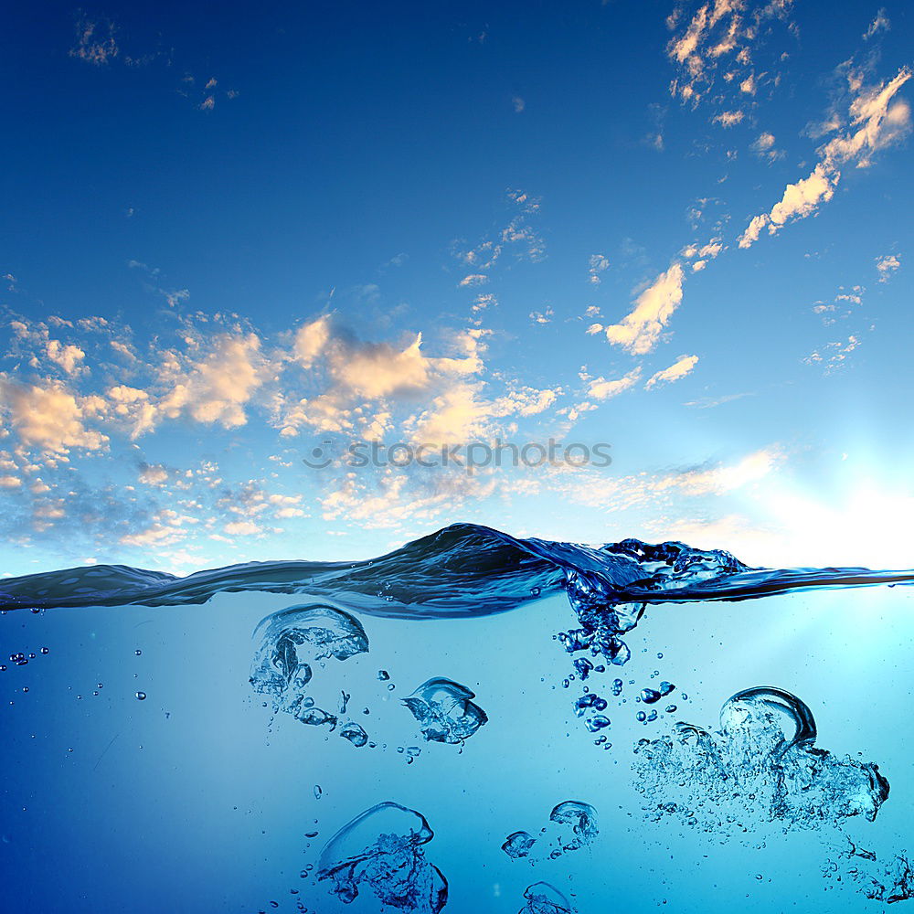 Similar – Wave in clear water with backlight