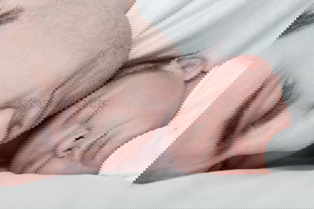 Image, Stock Photo Man kissing to peaceful newborn lying over bed