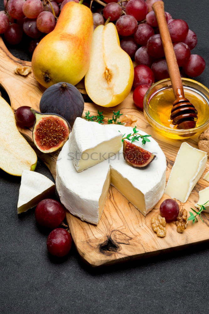 Similar – Image, Stock Photo Flammkuchen with grapes and sheep cheese bake