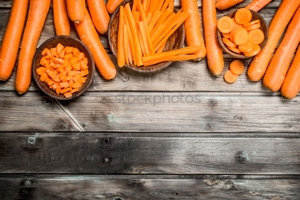 Similar – Large fresh carrots in a female hand