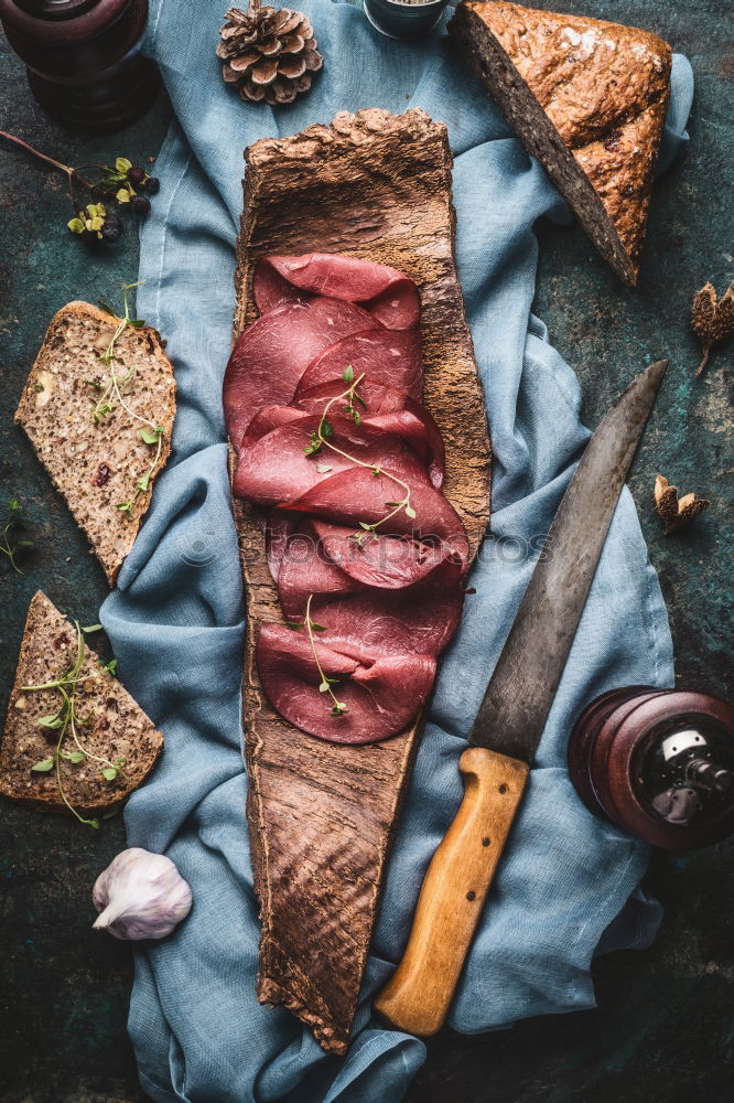 Image, Stock Photo Venison ham with nut bread served on tree bark