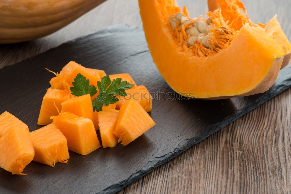 Similar – Piece of raw pumpkin