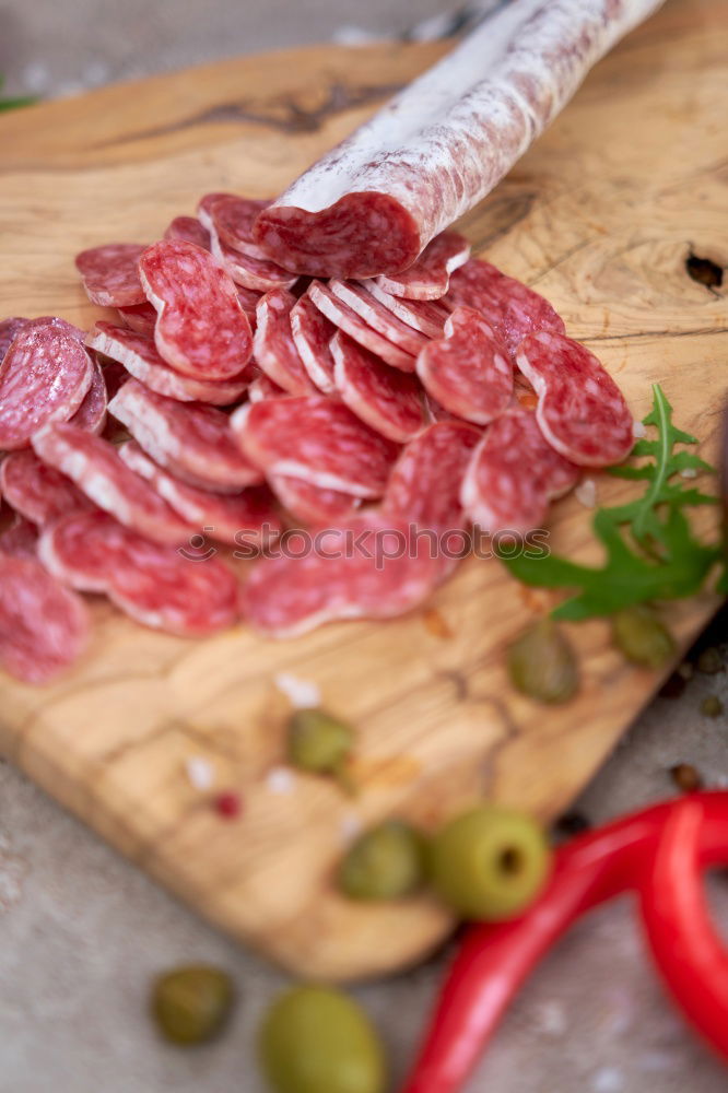 Similar – Image, Stock Photo Bruschetta with Italian sausage, ham and pesto