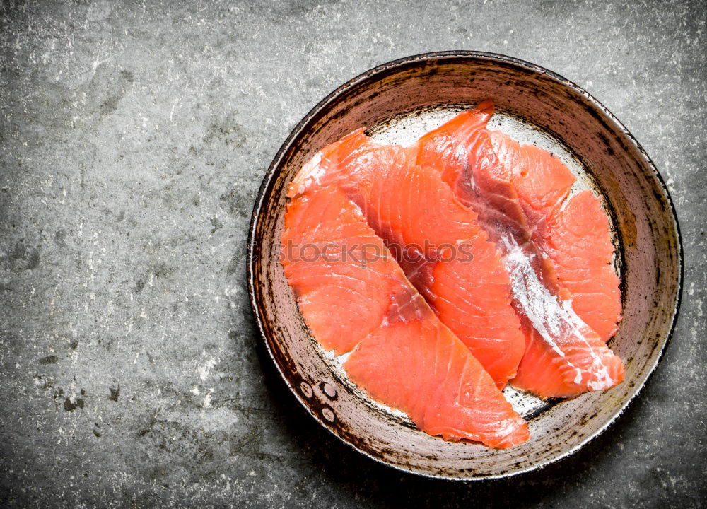 Fresh raw salmon on a wooden cutting board