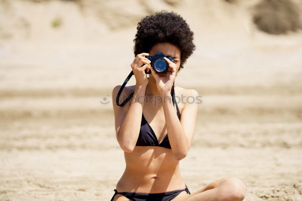 Similar – Image, Stock Photo Beautiful young woman wearing a bikini in a wooden foot bridge at the beach