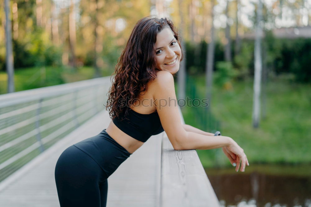 Similar – Young black woman with afro hairstyle smiling in urban park