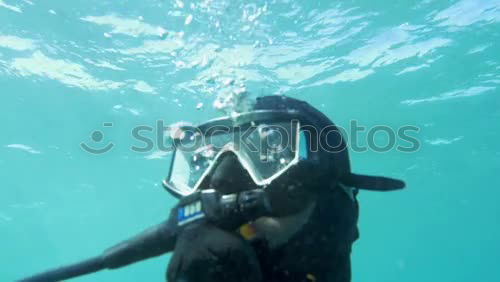 Similar – Diver with Bubbles II