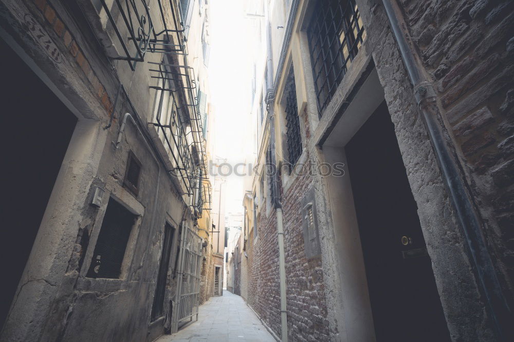 The narrow streets with tall buildings