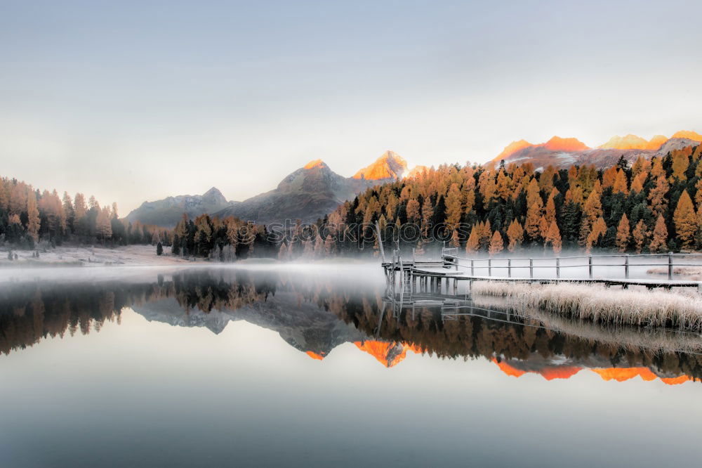 Similar – Snow-capped mountains and frozen river