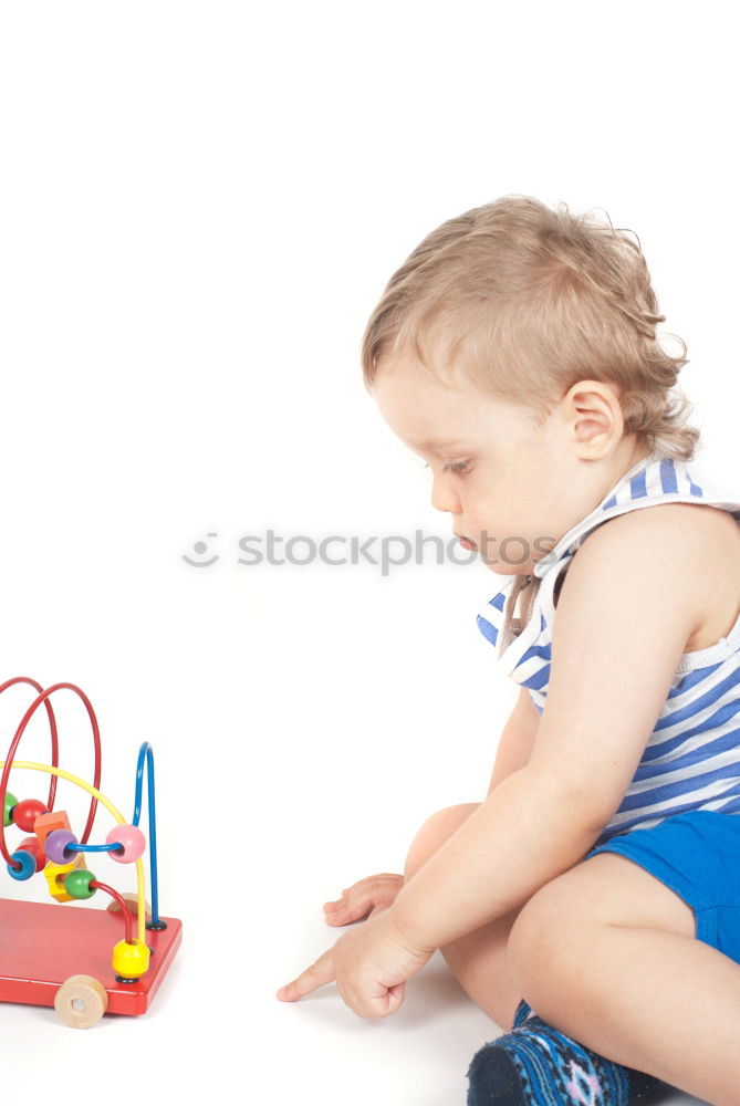 Similar – Image, Stock Photo Happy baby playing with toy blocks.