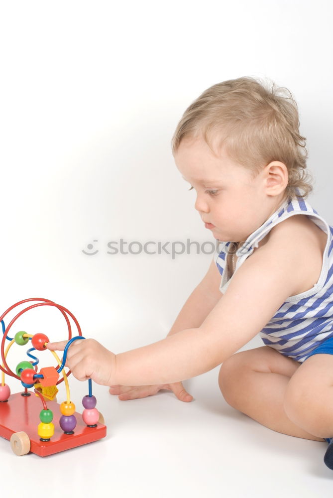 Similar – Baby in a bed in frame of heart shape. Out of focus baby