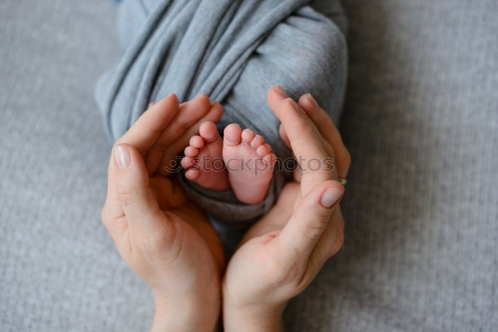 Similar – Image, Stock Photo Mother holding newborn baby son at the day time. Concept of happy family.