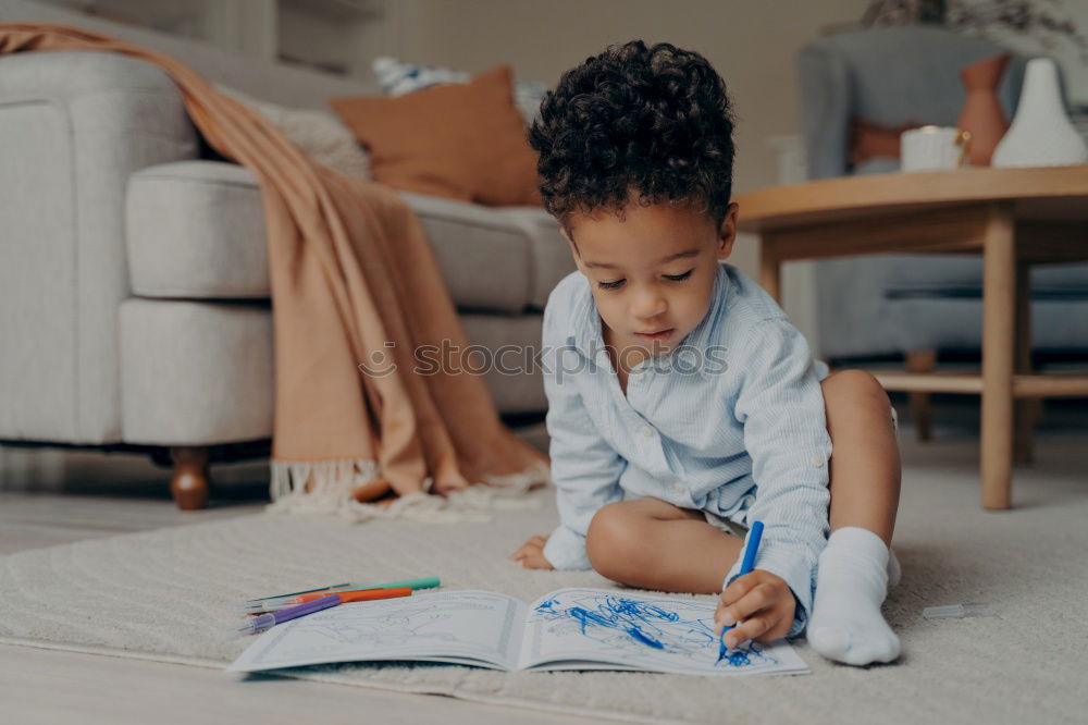 Similar – Image, Stock Photo Little girl doing homework on bed at home