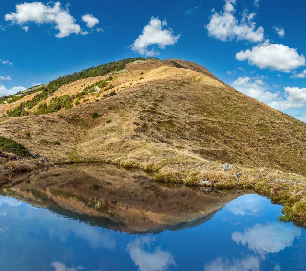 Similar – Lake in sunny mountains