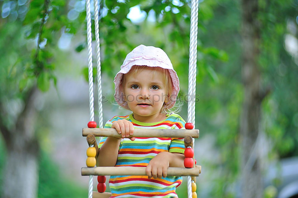 Similar – Child climbing on the playground in autumn