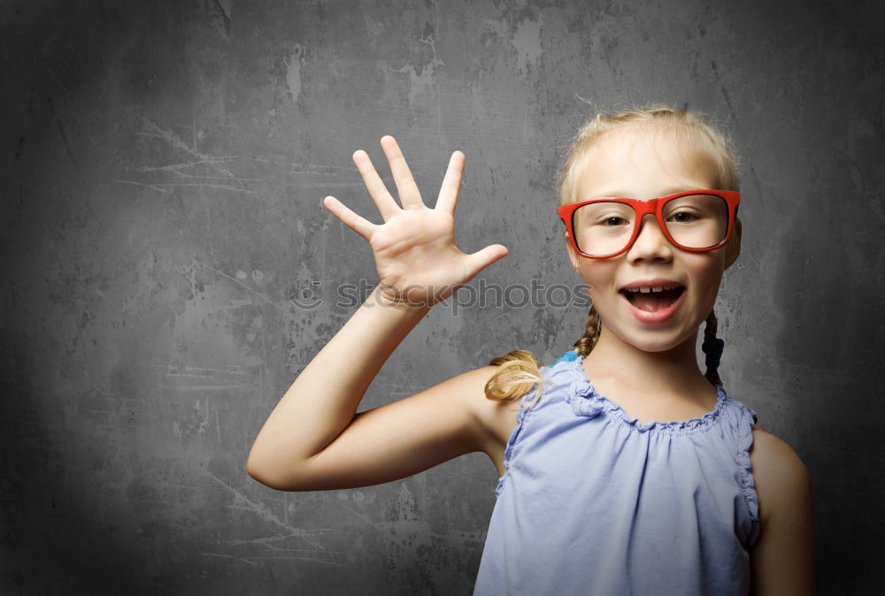 Similar – Cute schoolgirl posing in a classroom