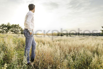 Similar – Image, Stock Photo Man walking on sunny field