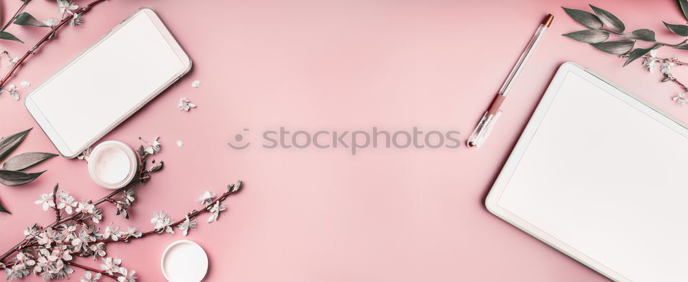 Image, Stock Photo Smartphone and tablet pc mock up on pastel pink desktop background with cosmetic, stationery supples and white blossom branches, top view. Beaut blog and female business concept. Flat lay, banner