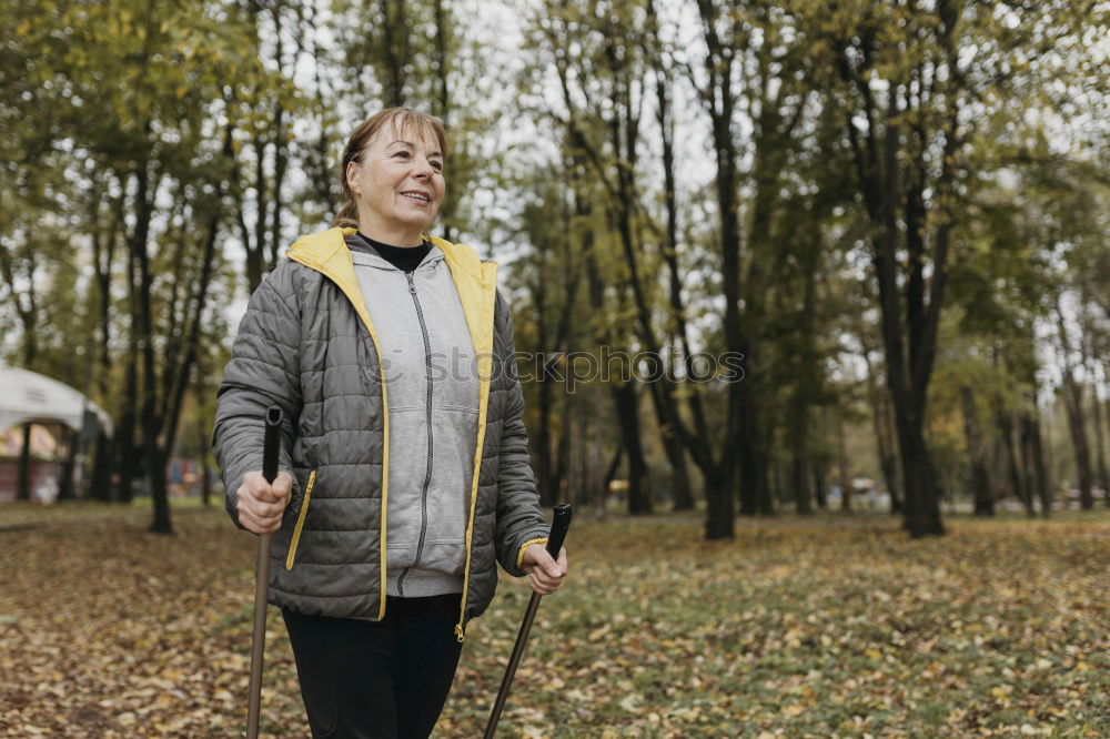 Similar – Happy senior couple on a hike trough green fields