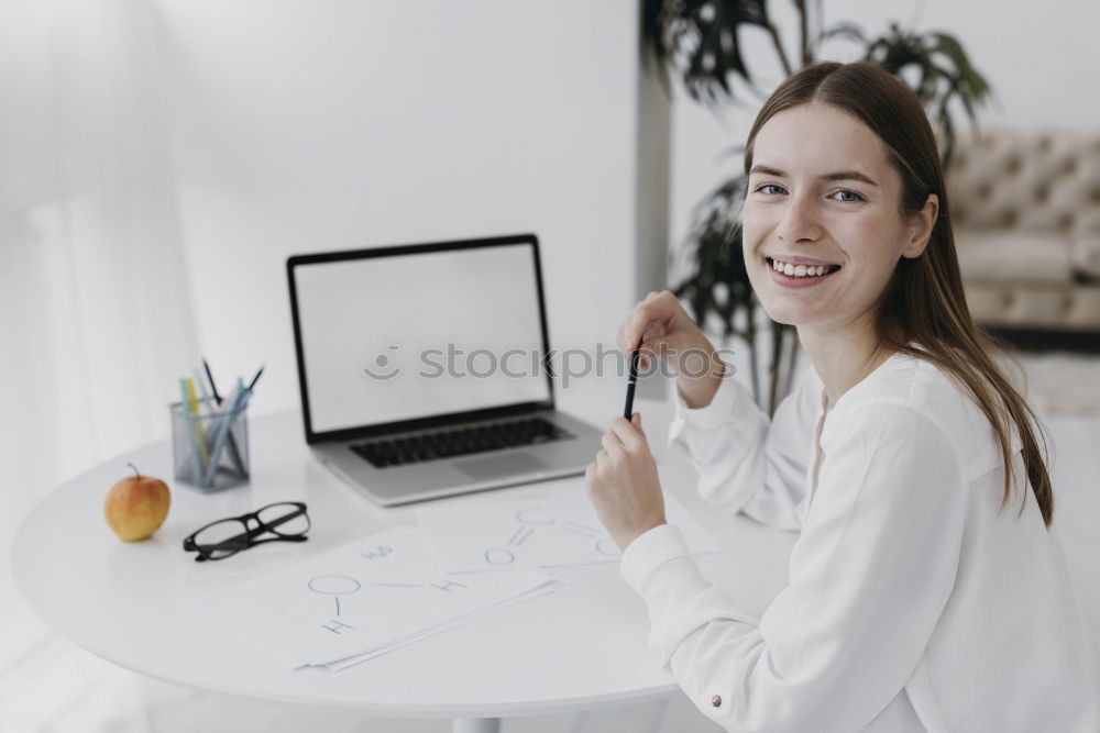 Similar – Young woman sitting at a kitchen table