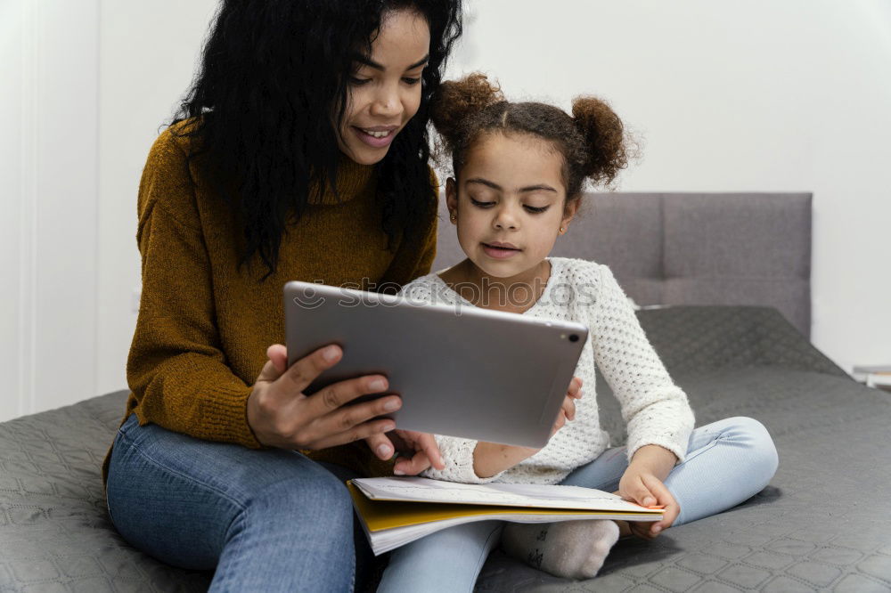 Similar – happy mother and toddler son using tablet