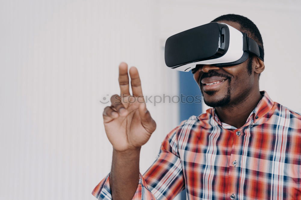 Similar – Image, Stock Photo Father and son playing with VR glasses.