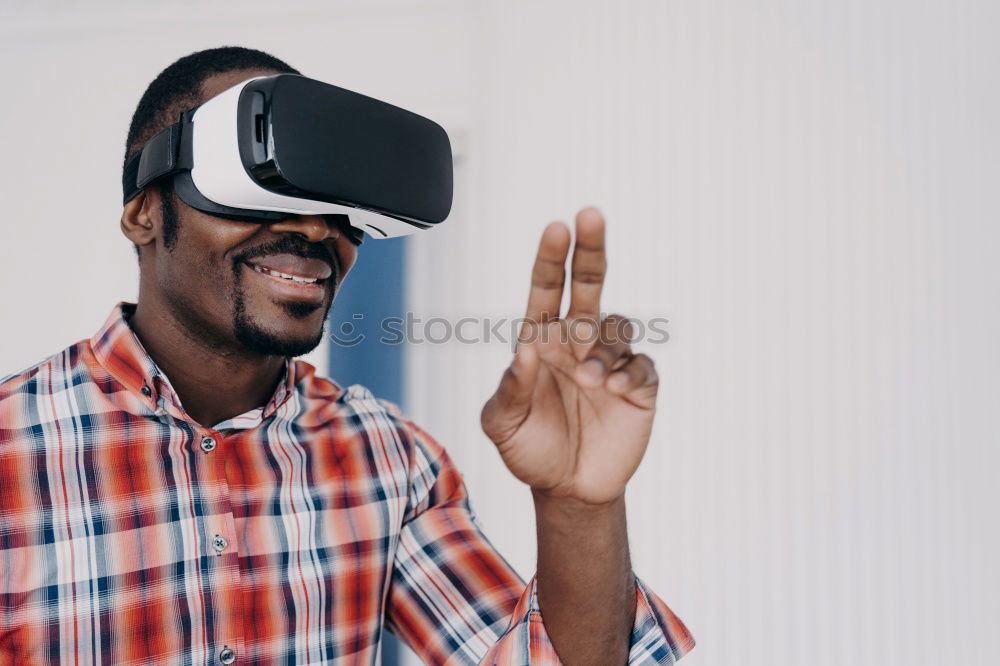 Similar – Image, Stock Photo Father and son playing with VR glasses.