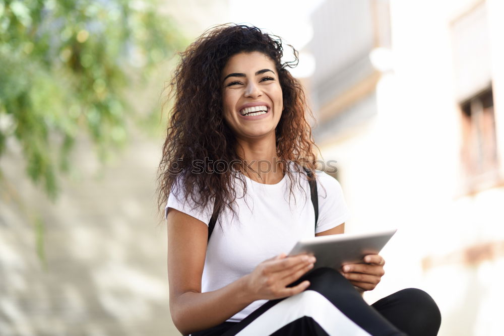 Image, Stock Photo Smiling African woman using digital tablet outdoors