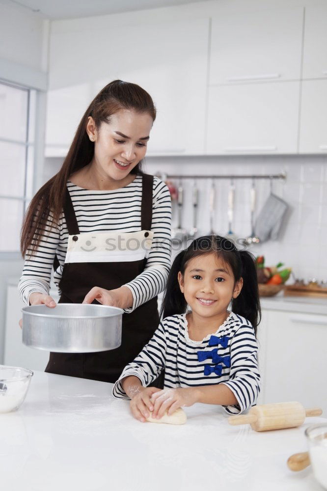 Similar – little african girl making cupcakes in kitchen