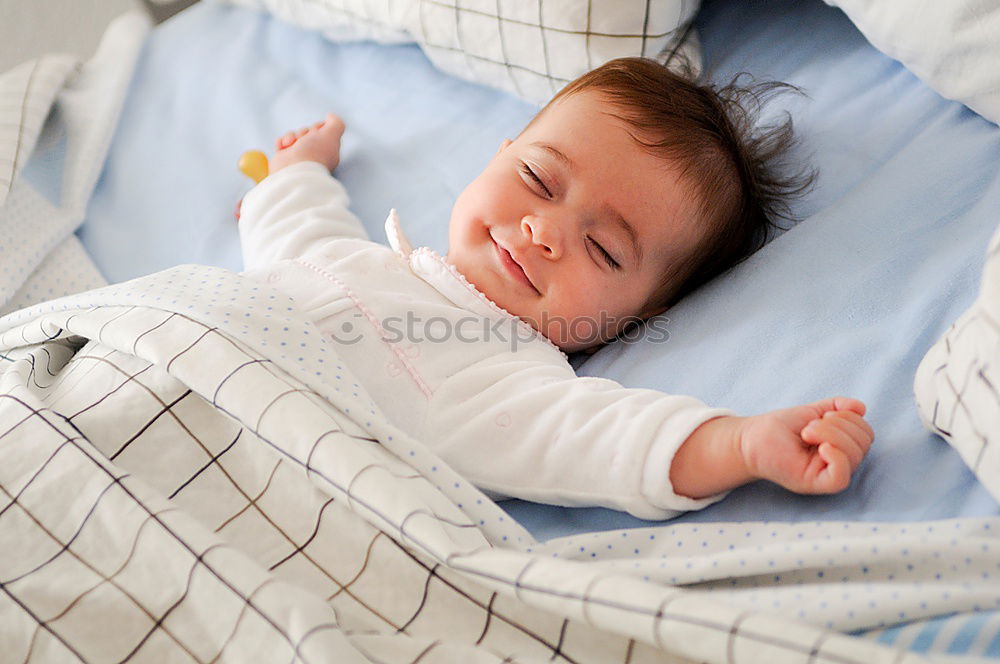 Similar – Little girl lying in a bed with teddy bear at the morning