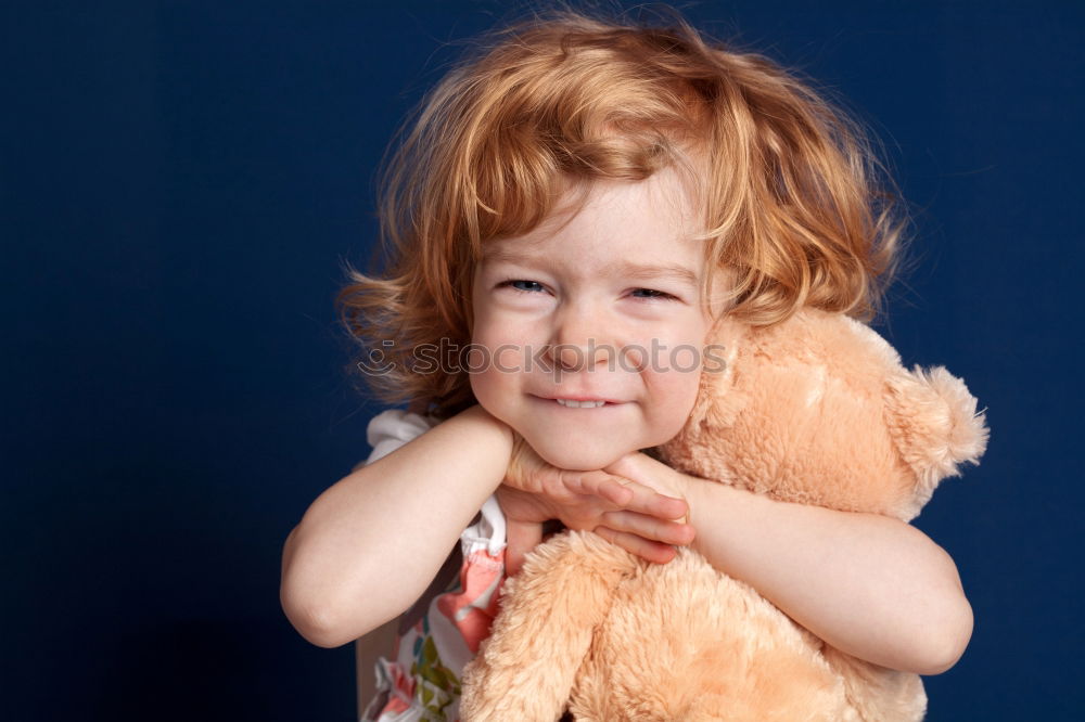 Similar – sad little girl holding toy with her hands