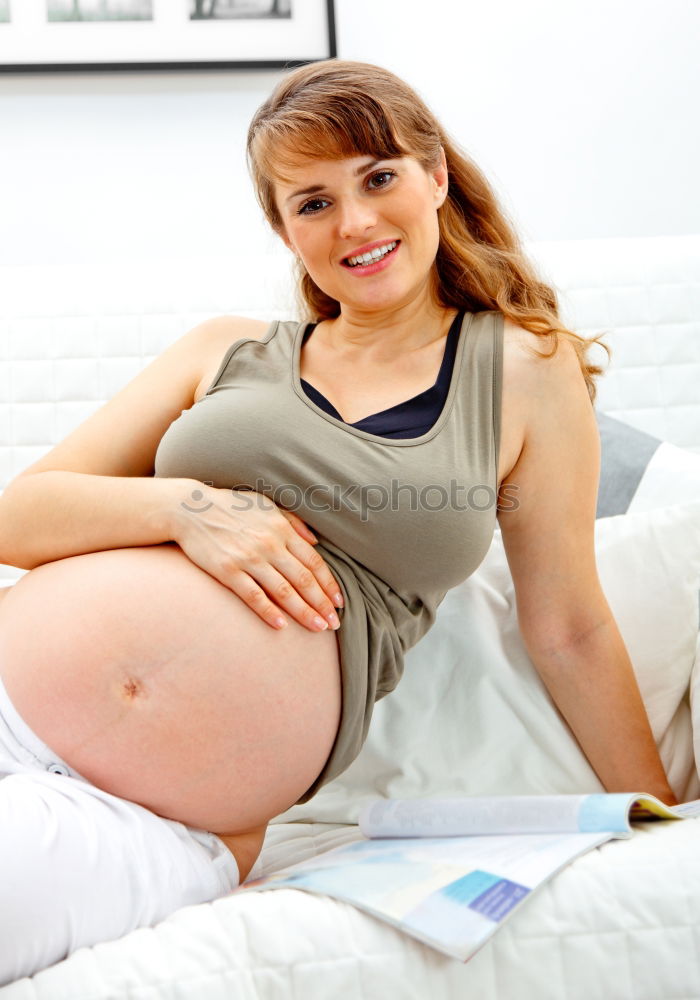 Similar – Pregnant woman touching her belly