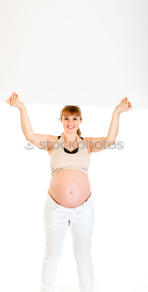 Similar – young redhead woman with curls and freckles stands barefoot in hot pants in front of white door and smiles