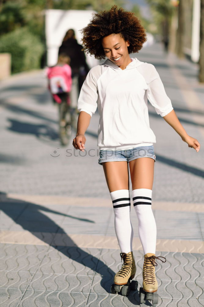 Similar – Image, Stock Photo Happy mixed woman with afro hair laughing outdoors.