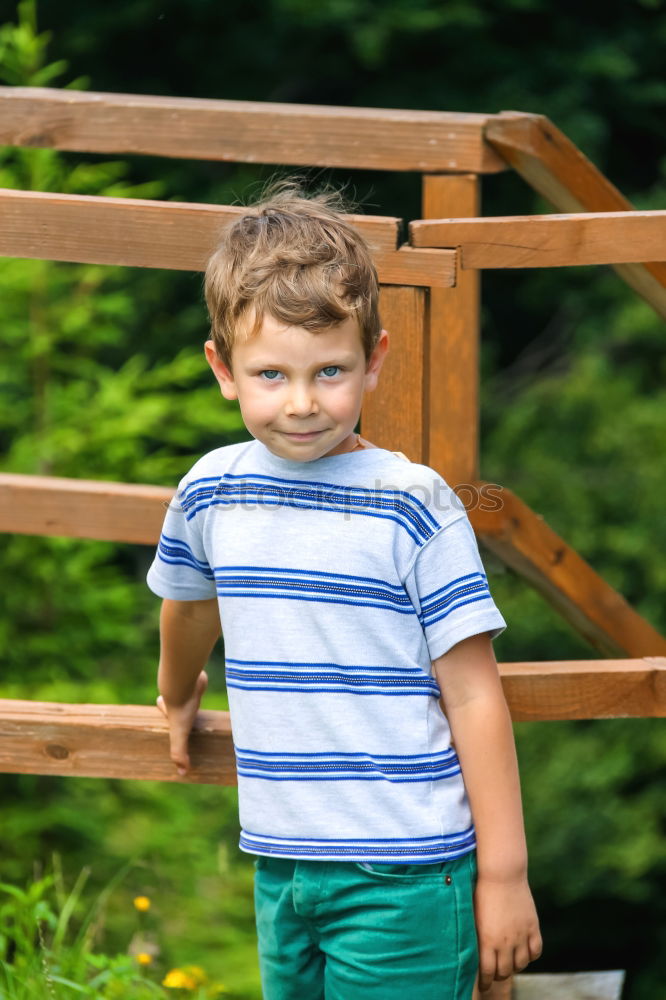 Similar – Cute child in the woods playing alone