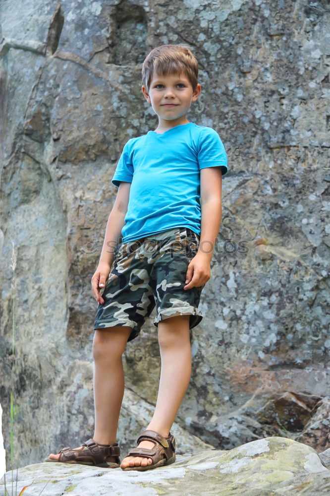 Similar – Cute child in the woods playing alone