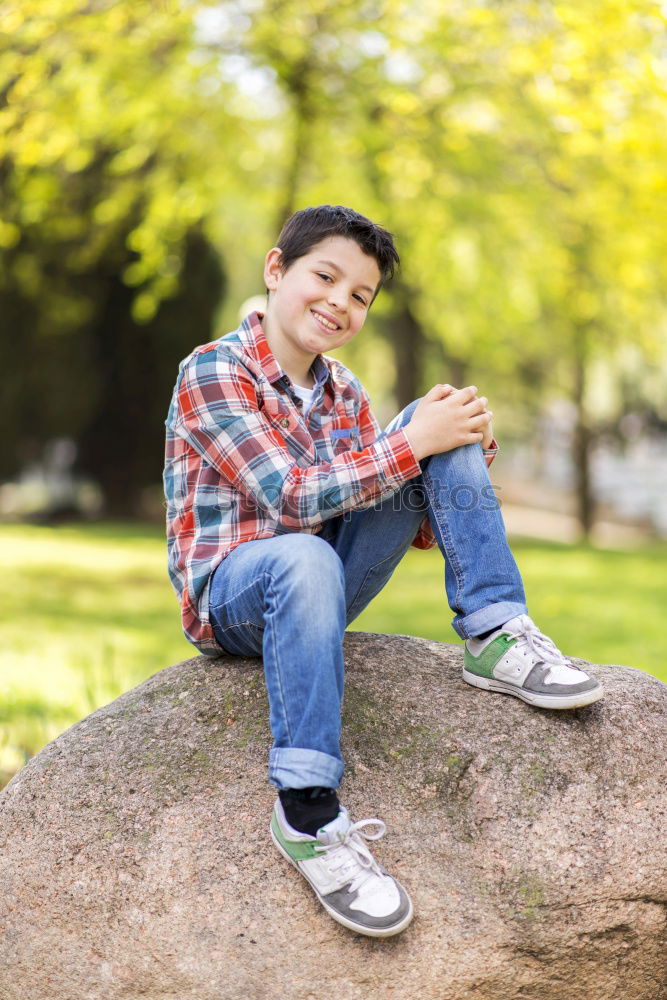 Smart casual wearing teen posing outdoors