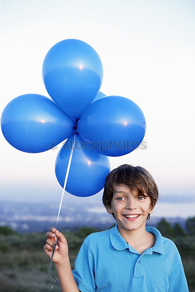 Image, Stock Photo little girl with balloons standing on the beach at the day time.