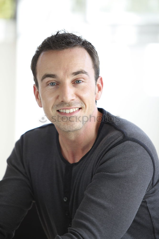 Similar – Man sitting in a bench on a beautiful maroon background