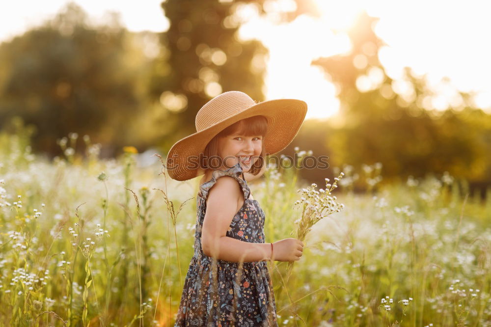 Similar – child girl in country style plaid shirt and hat