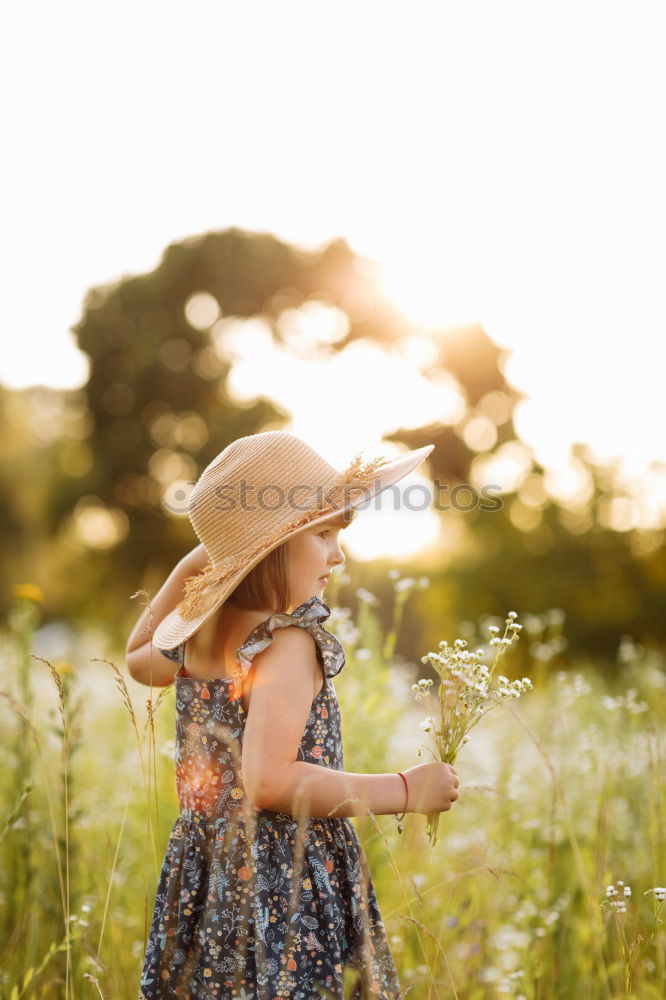 Similar – Kleines Mädchen im Naturfeld mit schönem Kleid